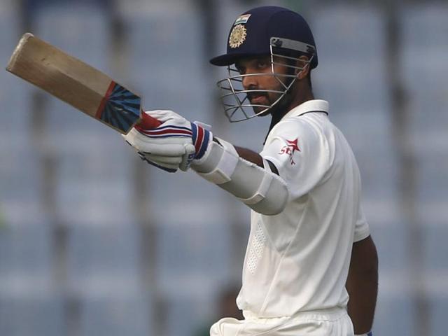 Indian batsman Ajinkya Rahane raises his bat after scoring a half-century against South Africa on the first day of the fourth Test at the Feroze Shah Kotla Stadium in New Delhi on December 3, 2015. (AP Photo)