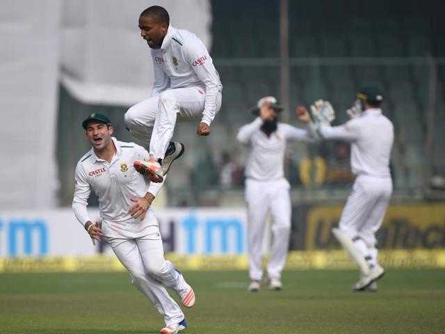 Dane Piedt (C) leaps in celebration after dismissing Murali Vijay. (AFP Photo)