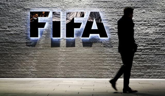 A journalist walks in front of Fifa's headquarters in Zurich, Switzerland December 2, 2015. (Reuters Photo) A journalist walks in front of Fifa's headquarters in Zurich, Switzerland December 2, 2015. (Reuters Photo)
