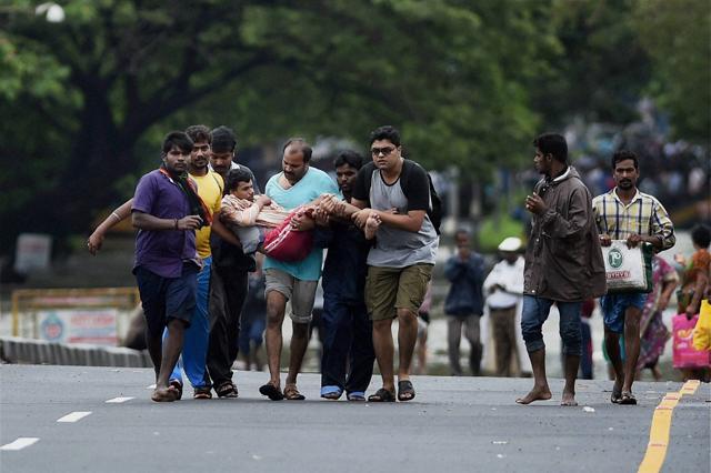 A man was rescued from his flooded house in Kotturpuram area in Chennai on Wednesday. (PTI) A man was rescued from his flooded house in Kotturpuram area in Chennai on Wednesday. (PTI)