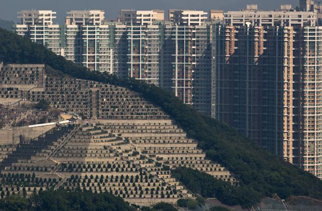 In this Nov. 22, 2015 photo, graves cover a hillside in front of apartment buildings in Hong Kong,the cramped southern Chinese city of 7.2 million. (AP) In this Nov. 22, 2015 photo, graves cover a hillside in front of apartment buildings in Hong Kong,the cramped southern Chinese city of 7.2 million. (AP)