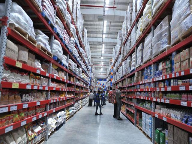 A file picture shows Indian shoppers browsing through the products of a newly opened Bharti Wal-Mart Best Price Modern wholesale store in Hyderabad. (AFP)