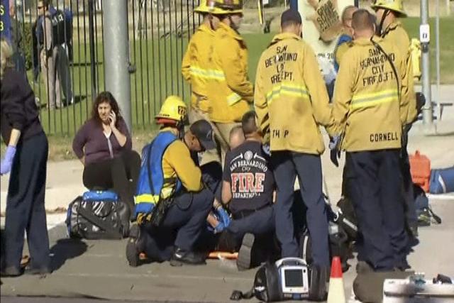 Rescue crews tend to the injured in the intersection outside the Inland Regional Center in San Bernardino, California in this still image taken from video December 2, 2015. (REUTERS Photo) Rescue crews tend to the injured in the intersection outside the Inland Regional Center in San Bernardino, California in this still image taken from video December 2, 2015. (REUTERS Photo)