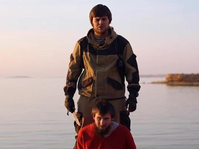 This image made from video released by Islamic State militants, shows a man who identified himself as Magomed Khasayev of Chechnya, bound and kneeling in front of another Russian-speaking man with a knife. (AP Photo) This image made from video released by Islamic State militants, shows a man who identified himself as Magomed Khasayev of Chechnya, bound and kneeling in front of another Russian-speaking man with a knife. (AP Photo)
