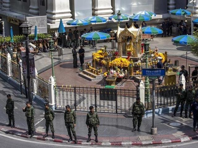 Military personnel and police officers stand guard before a crime re-enactment near the bomb site at Erawan Shrine in Bangkok, Thailand. (Reuters File Photo) Military personnel and police officers stand guard before a crime re-enactment near the bomb site at Erawan Shrine in Bangkok, Thailand. (Reuters File Photo)