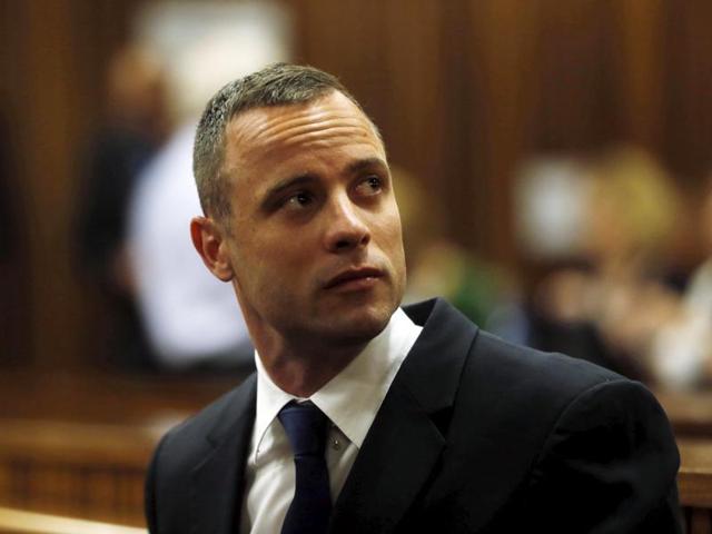 Olympic and paralympic track star Oscar Pistorius sits in the dock in the North Gauteng High Court in Pretoria in this May 6, 2014, file photo.(REUTERS)