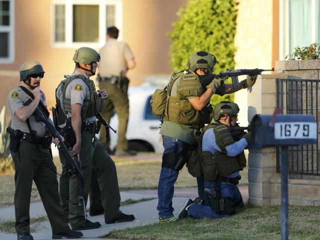 Police officers conduct a manhunt after a mass shooting in San Bernardino, California. Assailants opened fire on a holiday party on Wednesday at a social services agency. (REUTERS)