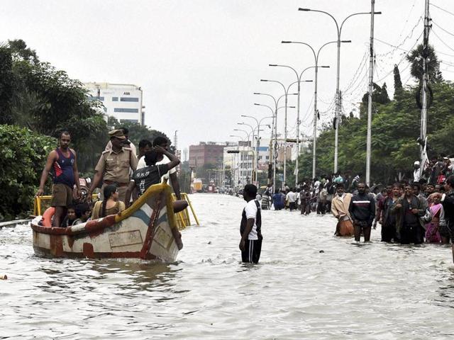 People are rescued from their waterlogged houses during heavy rains in Chennai on Wednesday. (PTI)