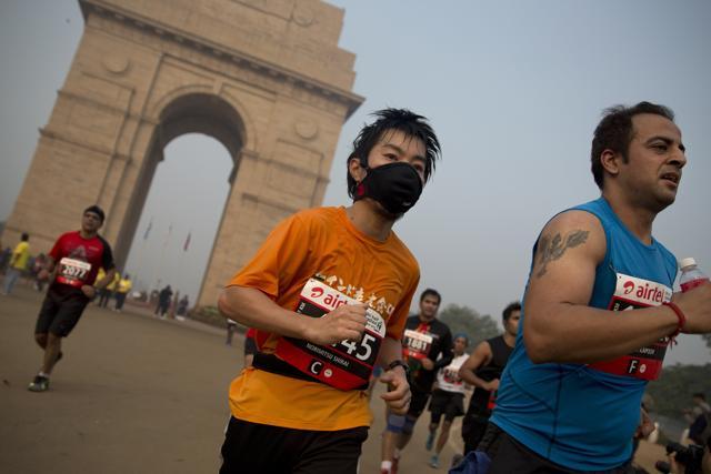 A participant wears a mask as he runs past India Gate during the Airtel Delhi Half Marathon in New Delhi on November 29, 2015.The tens of thousands of people who participated had more than just running 21 kilometres (13 miles) through New Delhi’s streets on a misty, chilly morning to deal with. They also had to overcome the city’s unparalleled air pollution. (AP Photo) A participant wears a mask as he runs past India Gate during the Airtel Delhi Half Marathon in New Delhi on November 29, 2015.The tens of thousands of people who participated had more than just running 21 kilometres (13 miles) through New Delhi’s streets on a misty, chilly morning to deal with. They also had to overcome the city’s unparalleled air pollution. (AP Photo)
