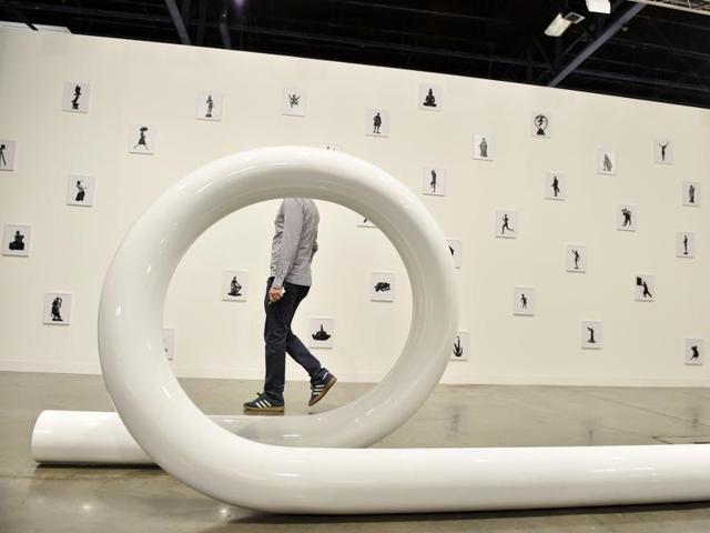 An attendee views Solar Feminine, 2013 by artist Carol Bove (made of powder coated steel) at the Art Basel Miami Beach - VIP Preview at the Miami Beach Convention Center on December 2, 2015 in Miami Beach, Florida. (AFP) An attendee views Solar Feminine, 2013 by artist Carol Bove (made of powder coated steel) at the Art Basel Miami Beach - VIP Preview at the Miami Beach Convention Center on December 2, 2015 in Miami Beach, Florida. (AFP)