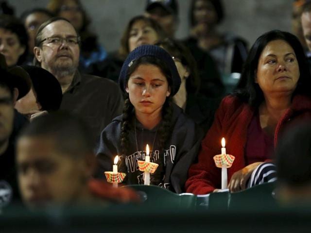 Attendees reflect on the tragedy of Wednesday's shooting attack during a candlelight vigil in San Bernardino, California, December 3, 2015 (REUTERS) Attendees reflect on the tragedy of Wednesday's shooting attack during a candlelight vigil in San Bernardino, California, December 3, 2015 (REUTERS)