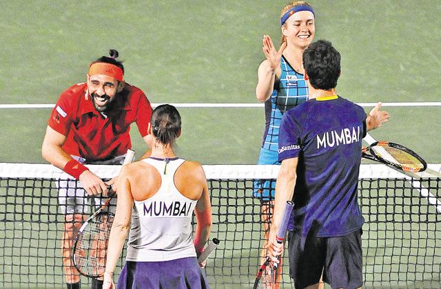 Elina Svitolina and Marcos Baghdatis (in red) of Punjab Marshalls in action during the CTL match against Mumbai Tennis Masters in Chandigarh on Saturday. (Keshav Singh/HT Photo)