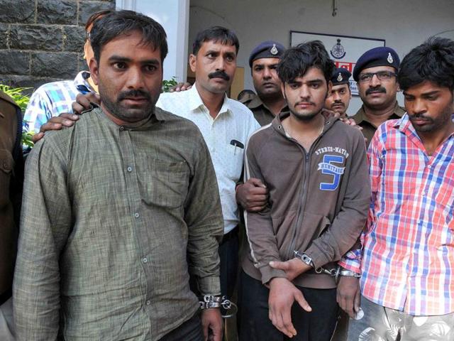 The murder accused in police custody in Indore on Friday. (Shankar Mourya/ HT photo) The murder accused in police custody in Indore on Friday. (Shankar Mourya/ HT photo)