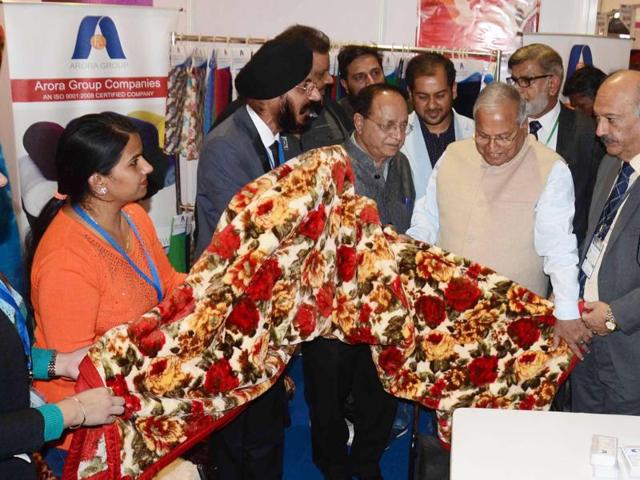 Punjab industries minister Madan Mohan Mittal and others at a stall during the Punjab International Trade Expo-2015 (PITEX 2015) in Amritsar on Friday.   (Sameer Sehgal/HT Photo) 