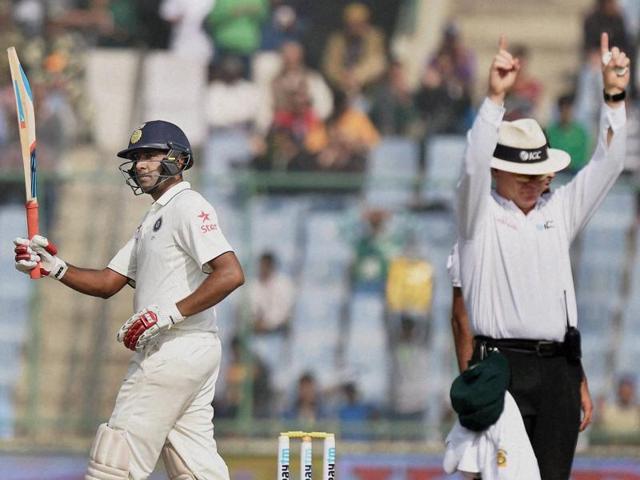 Ashwin raises his bat after scoring a half-century. (PTI Photo) Ashwin raises his bat after scoring a half-century. (PTI Photo)