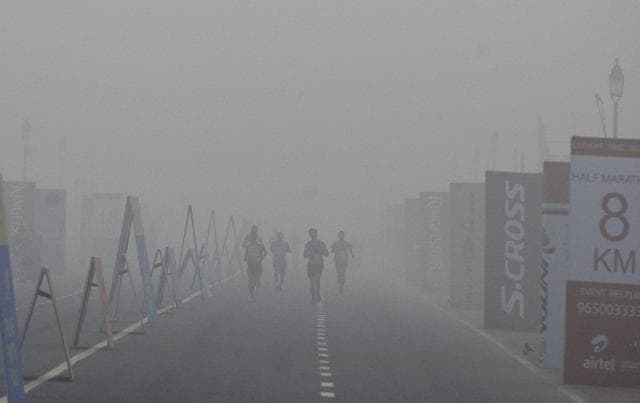 Participants run along the hazy, smog-filled streets during the Airtel Delhi Half Marathon. (AP Photo) Participants run along the hazy, smog-filled streets during the Airtel Delhi Half Marathon. (AP Photo)