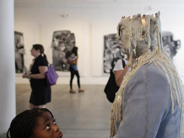 A girl looks up at a sculpture by artist Urs Fischer titled Zhou Yinghua, at an exhibit called Unrealism, during Miami Art Week, Thursday, December 3, 2015, in the Design District neighbourhood of Miami. (AP) A girl looks up at a sculpture by artist Urs Fischer titled Zhou Yinghua, at an exhibit called Unrealism, during Miami Art Week, Thursday, December 3, 2015, in the Design District neighbourhood of Miami. (AP)