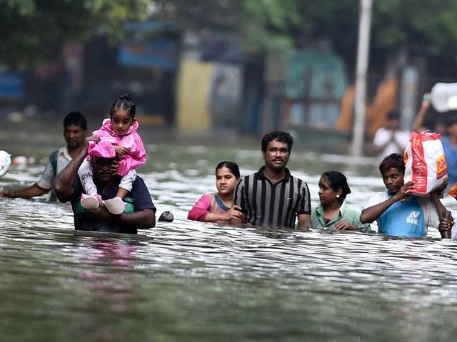 Chennaiites wade through flood waters to flee, rescue loved ones ...