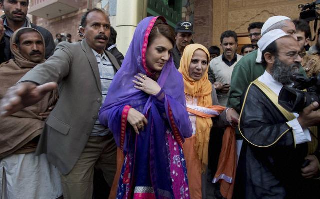 In this file photo, Reham Khan (C), wife of Pakistan's cricketer-turned-politician Imran Khan, leaves a local madrassa, or seminary, in Islamabad, Pakistan. (AP Photo) In this file photo, Reham Khan (C), wife of Pakistan's cricketer-turned-politician Imran Khan, leaves a local madrassa, or seminary, in Islamabad, Pakistan. (AP Photo)