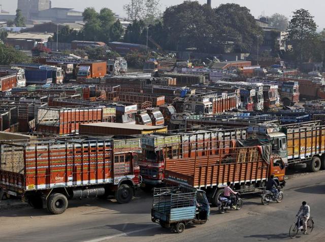 Trucks are seen parked in an open plot near a national highway on the outskirts of Ahmedabad. India will force all commercial trucks more than 15 years old off the road from April and is reviewing how it checks vehicle emissions. (REUTERS) Trucks are seen parked in an open plot near a national highway on the outskirts of Ahmedabad. India will force all commercial trucks more than 15 years old off the road from April and is reviewing how it checks vehicle emissions. (REUTERS)