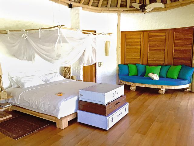 Sun and sail: Soneva Fushi (above) has Robinson Crusoe appeal.