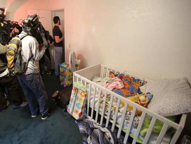Members of the media crowd into a child's room inside the home of suspects Syed Rizwan Farook and Tashfeen Malik in Redlands, California.(AP) Members of the media crowd into a child's room inside the home of suspects Syed Rizwan Farook and Tashfeen Malik in Redlands, California.(AP)