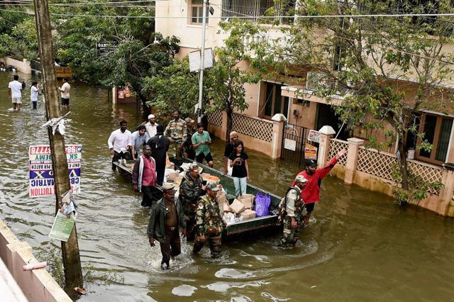 Army personnel providing relief material to people in Velachery, one of the worst flood-hit areas in Chennai on Saturday. (PTI )
