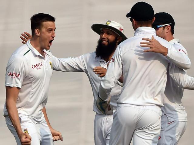 South Africa’s Morne Morkel celebrates with teammates after the dismissal of India’s Rohit Sharma during the third day of the fourth Test match between India and South Africa at The Feroz Shah Kotla Stadium in New Delhi on December 5, 2015. (AFP Photo) South Africa’s Morne Morkel celebrates with teammates after the dismissal of India’s Rohit Sharma during the third day of the fourth Test match between India and South Africa at The Feroz Shah Kotla Stadium in New Delhi on December 5, 2015. (AFP Photo)