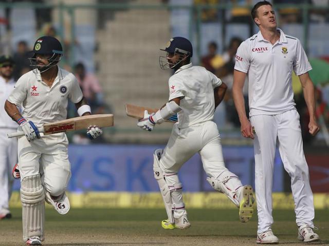 South African bowler Morne Morkel, right watches as Indian batsmen Virat Kohli, left and Ajinkya Rahane, second right run between the wickets. (AP Photo) South African bowler Morne Morkel, right watches as Indian batsmen Virat Kohli, left and Ajinkya Rahane, second right run between the wickets. (AP Photo)