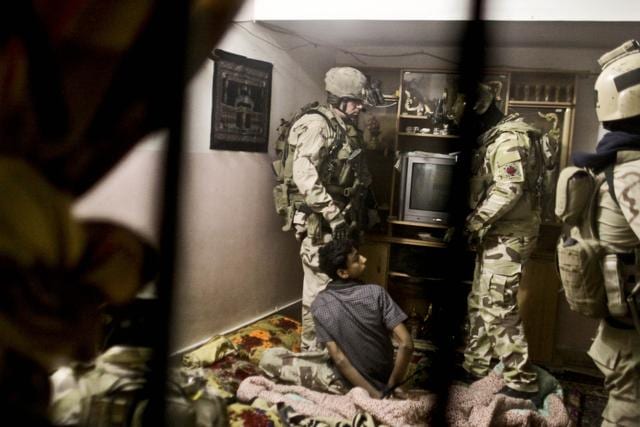 US special operations soldier watch as a teenager is handcuffed on the floor during a raid. The document was among the seven terabytes of data taken from a raid on Aby Sayyaf conducted by the special forces. (AP Photo) US special operations soldier watch as a teenager is handcuffed on the floor during a raid. The document was among the seven terabytes of data taken from a raid on Aby Sayyaf conducted by the special forces. (AP Photo)