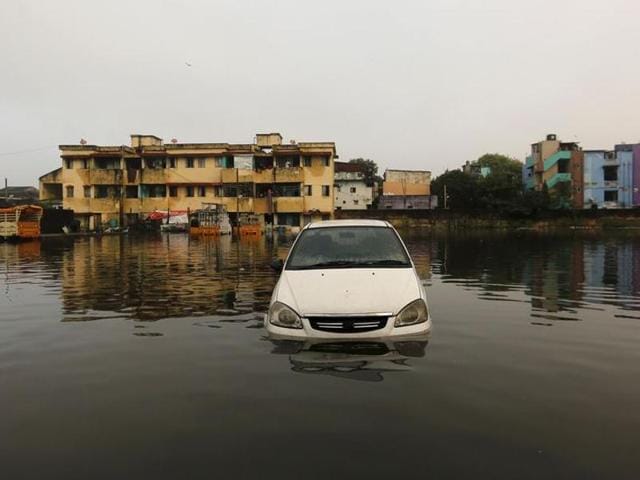 A car is seen in the flood waters at a neighbourhood in Chennai on December 4, 2015. The flood-ravaged city is struggling to return to normalcy with partial restoration of telecommunication and train services. (REUTERS) A car is seen in the flood waters at a neighbourhood in Chennai on December 4, 2015. The flood-ravaged city is struggling to return to normalcy with partial restoration of telecommunication and train services. (REUTERS)