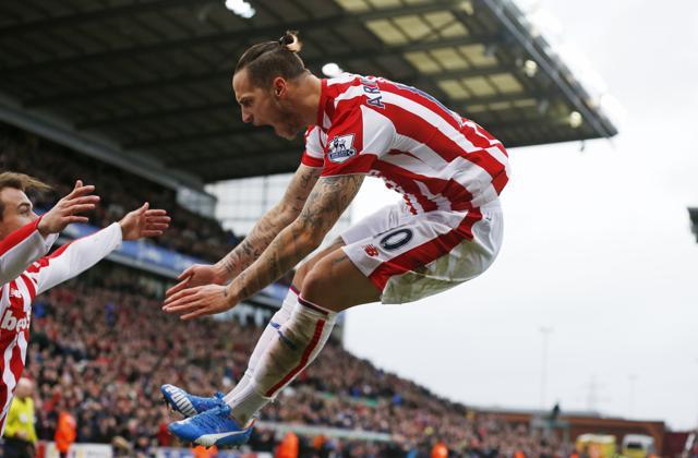 Marko Arnautovic, right, celebrates with Xherdan Shaqiri after scoring the first goal for Stoke City. (Reuters Photo)