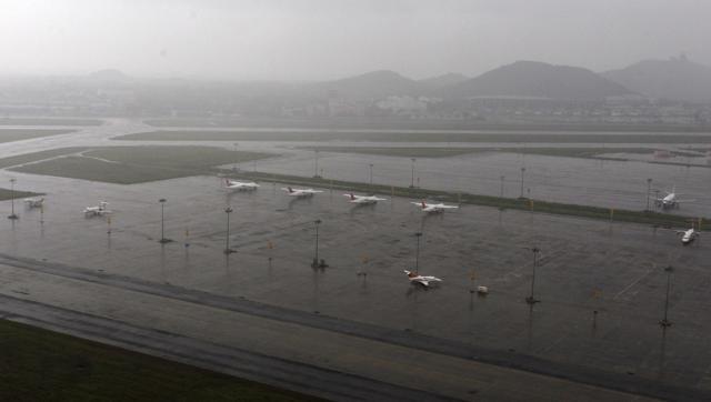 Planes are seen parked at waterlogged Chennai airport on Saturday. (PTI)
