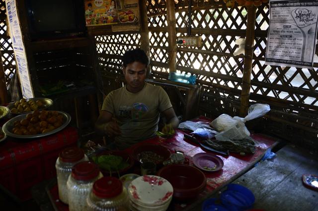Bangladeshi climate refugee Nur Hussain works in his restaurant in Cox's Bazar, after his resettlement from Kutbudia Island. (AFP) Bangladeshi climate refugee Nur Hussain works in his restaurant in Cox's Bazar, after his resettlement from Kutbudia Island. (AFP)