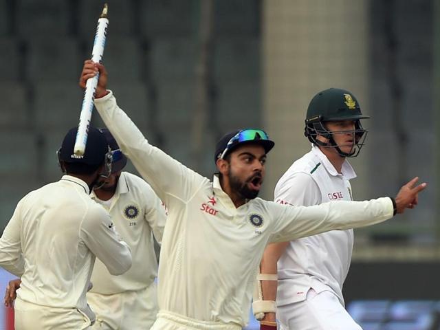 India's captain Virat Kohli takes the wicket in celebration after winning the fourth Test match against South Africa at the Feroz Shah Kotla stadium in New Delhi on December 7, 2015. (AFP Photo) India's captain Virat Kohli takes the wicket in celebration after winning the fourth Test match against South Africa at the Feroz Shah Kotla stadium in New Delhi on December 7, 2015. (AFP Photo)