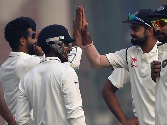 Virat Kohli, second from right, celebrates with Ravindra Jadeja, left, after the dismissal of Hashim Amla. (AFP Photo) Virat Kohli, second from right, celebrates with Ravindra Jadeja, left, after the dismissal of Hashim Amla. (AFP Photo)