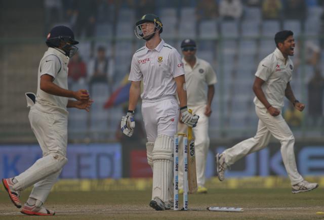 South Africa's Dane Vilas, center, walks back after being bowled by Umesh Yadav. (AP) South Africa's Dane Vilas, center, walks back after being bowled by Umesh Yadav. (AP)