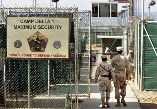 US military guards walk within Camp Delta military-run prison, at the Guantanamo Bay US Naval Base, Cuba. (AP Photo) US military guards walk within Camp Delta military-run prison, at the Guantanamo Bay US Naval Base, Cuba. (AP Photo)