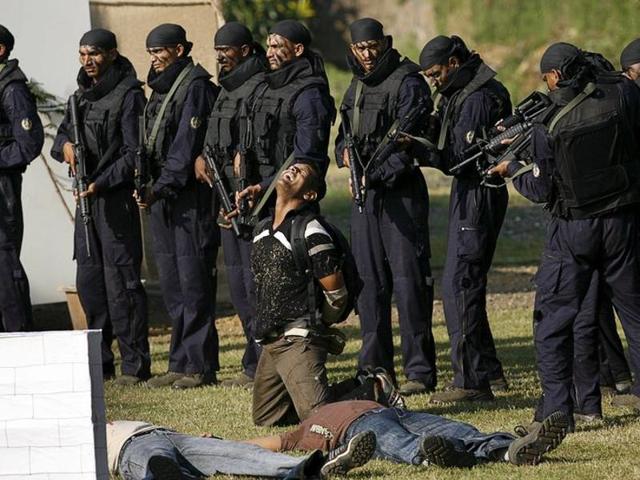 Members of the Force One Commandos from Maharashtra police demonstrate their skills during their inauguration ceremony in Mumbai. (REUTERS File Photo) Members of the Force One Commandos from Maharashtra police demonstrate their skills during their inauguration ceremony in Mumbai. (REUTERS File Photo)