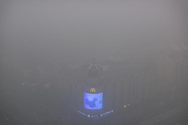 A video display on the side of a building shows a map of China amid heavy pollution and fog in Beijing. (AP Photo) A video display on the side of a building shows a map of China amid heavy pollution and fog in Beijing. (AP Photo)