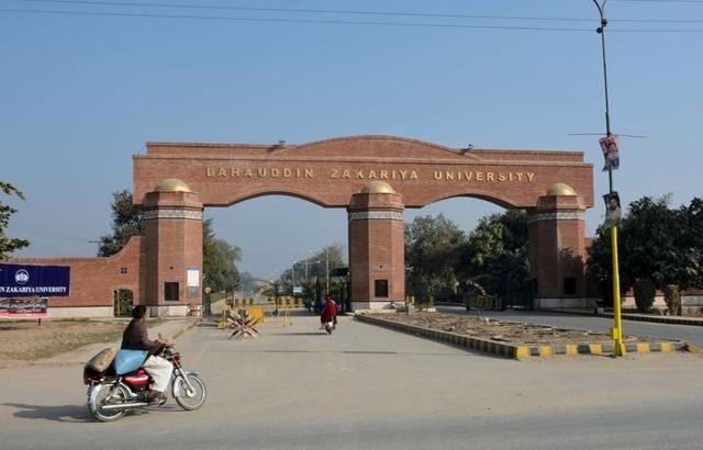 A man rides a motorcycle past the main gate of the Bahauddin Zakariya University, where Tashfeen Malik studied, in Multan, Pakistan. (REUTERS) A man rides a motorcycle past the main gate of the Bahauddin Zakariya University, where Tashfeen Malik studied, in Multan, Pakistan. (REUTERS)