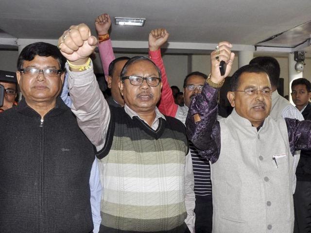 BJP MLAs Jadav Deka (left) and Prasanta Phukan shout slogans as they are pushed out of the Assembly in Guwahati. (PTI) BJP MLAs Jadav Deka (left) and Prasanta Phukan shout slogans as they are pushed out of the Assembly in Guwahati. (PTI)