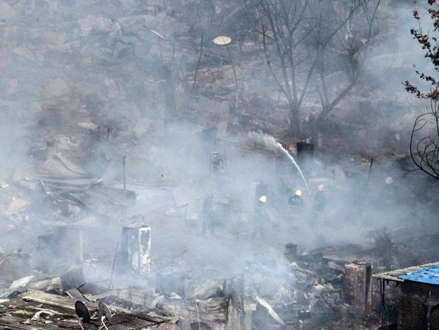 The fire was brought under control around 4.30pm and subsequently dampening operations were carried out throughout the evening. (Pratham Gokhale/ HT Photo)
