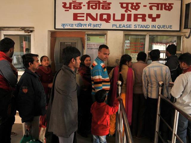 Passengers flock to the train station’s enquiry office to know about the status of their trains. (Pardeep Pandit/HT Photo)