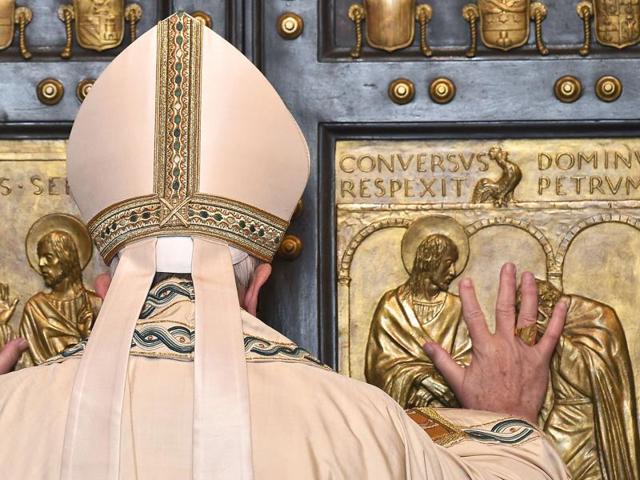 Pope Francis opens a "Holy Door" at St Peter's basilica to mark the start of the Jubilee Year of Mercy. (AFP) Pope Francis opens a "Holy Door" at St Peter's basilica to mark the start of the Jubilee Year of Mercy. (AFP)
