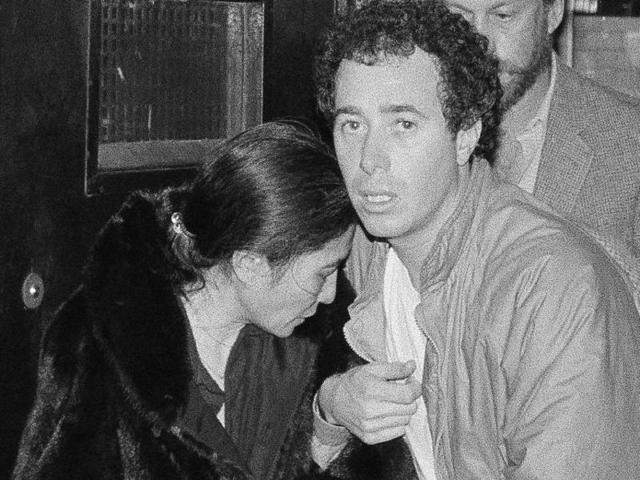 Yoko Ono and record producer David Geffen leave Roosevelt Hospital in New York after the death of her husband, John Lennon on December 9, 1980. (AP)