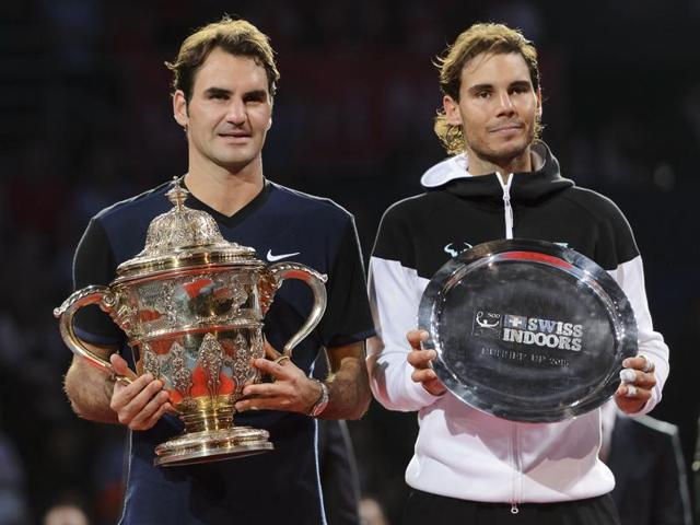 Roger Federer and Rafael Nadal share a word before their final match at the Swiss Indoors tennis tournament at the St. Jakobshalle in Basel, Switzerland, on November 1, 2015.(AP Photo)