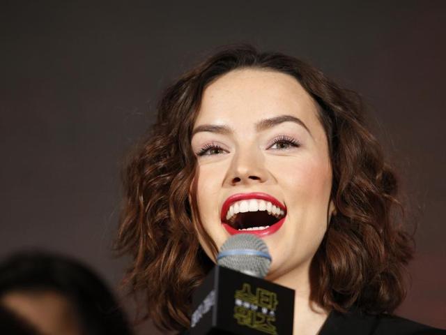 British actor Daisy Ridley smiles as she answers a reporter's question during a press conference for her new movie Star Wars: The Force Awakens in Seoul, South Korea. (AP)