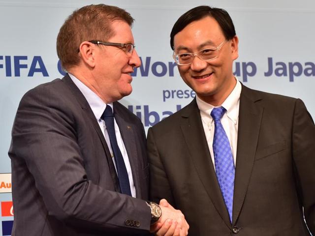 FIFA marketing director Thierry Weil shakes hands with Zhang Dazhong, CEO of Alibaba Sports Group, as they announce that Alibaba E-Auto will help sponsor the Club World Cup football tournament in Tokyo on December 9, 2015. (AFP Photo) FIFA marketing director Thierry Weil shakes hands with Zhang Dazhong, CEO of Alibaba Sports Group, as they announce that Alibaba E-Auto will help sponsor the Club World Cup football tournament in Tokyo on December 9, 2015. (AFP Photo)
