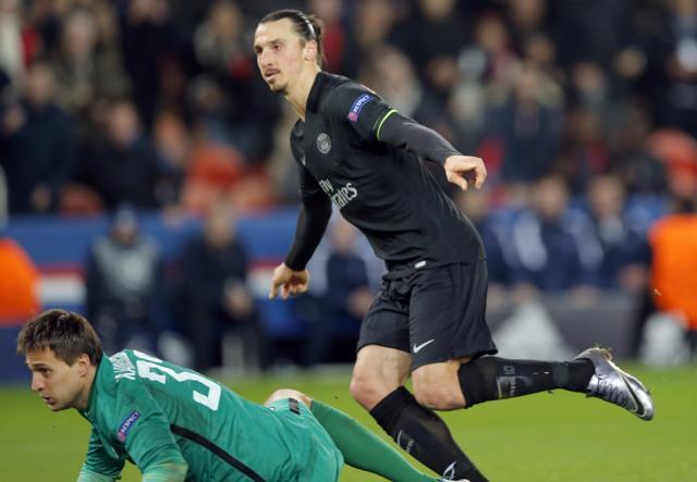 PSG's Zlatan Ibrahimovic scores his side's 2nd goal while Shakhtar's goalkeeper Anton Kanibolotskiy looks on during the Champions League Group A soccer match between PSG and FC Shakhtar at the Parc des Princes stadium on December 8, 2015. (AP Photo) PSG's Zlatan Ibrahimovic scores his side's 2nd goal while Shakhtar's goalkeeper Anton Kanibolotskiy looks on during the Champions League Group A soccer match between PSG and FC Shakhtar at the Parc des Princes stadium on December 8, 2015. (AP Photo)